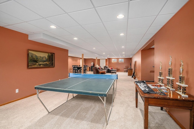 recreation room with recessed lighting, baseboards, light carpet, and a drop ceiling