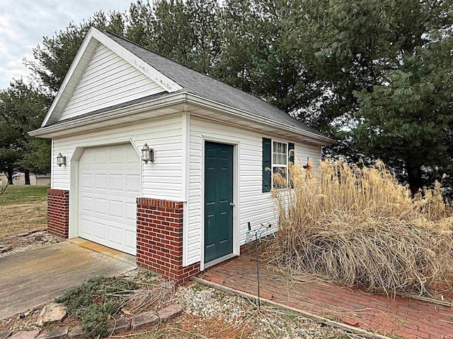 garage with concrete driveway