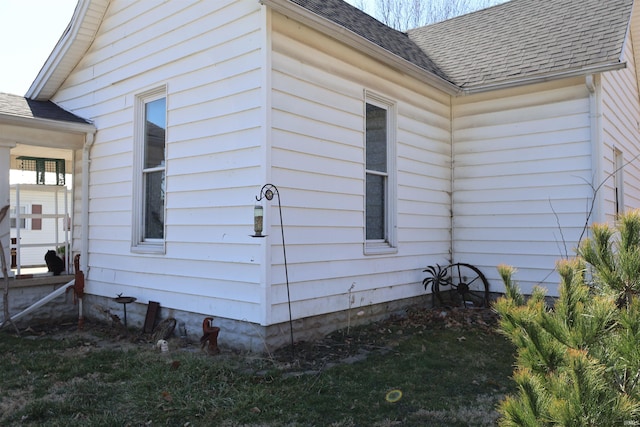 view of property exterior featuring a shingled roof