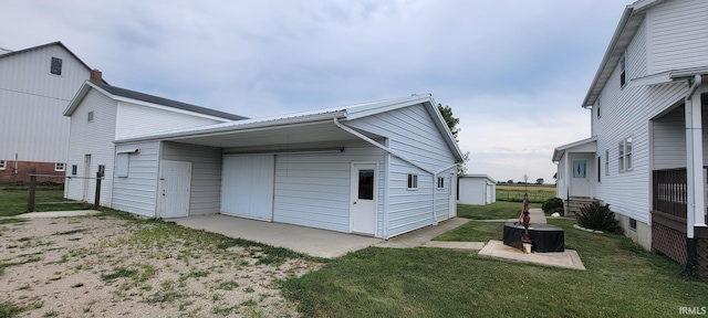 back of house featuring fence, a lawn, and entry steps