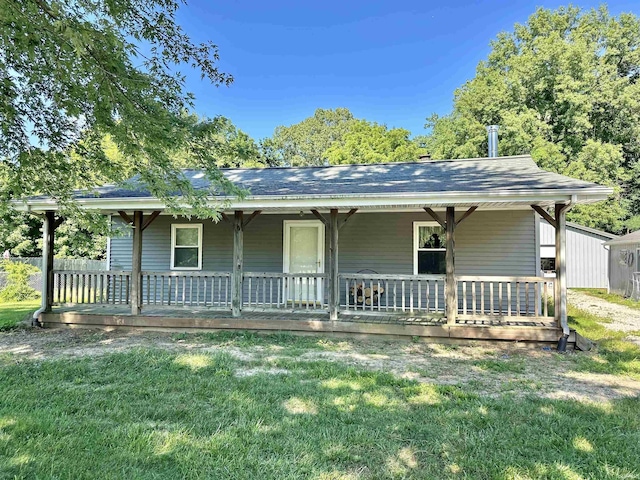 view of front of house with a porch and a front yard