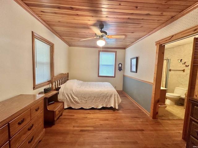 bedroom with ensuite bath, wood ceiling, light wood finished floors, and ornamental molding