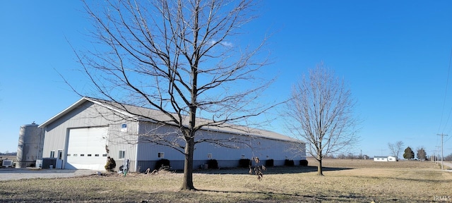 view of side of home featuring a yard