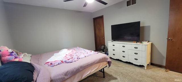 bedroom with ceiling fan, baseboards, visible vents, and light carpet