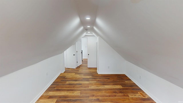 bonus room with wood finished floors, baseboards, visible vents, recessed lighting, and vaulted ceiling