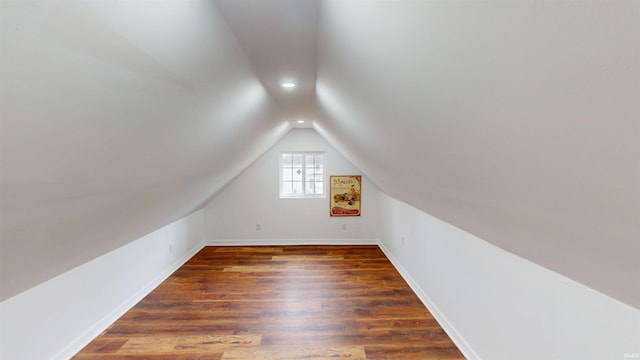 bonus room with recessed lighting, baseboards, lofted ceiling, and wood finished floors