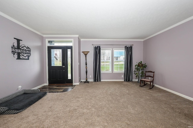 foyer featuring baseboards, carpet floors, and crown molding