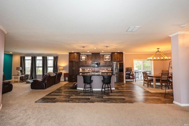 interior space featuring crown molding, baseboards, dark carpet, and a chandelier