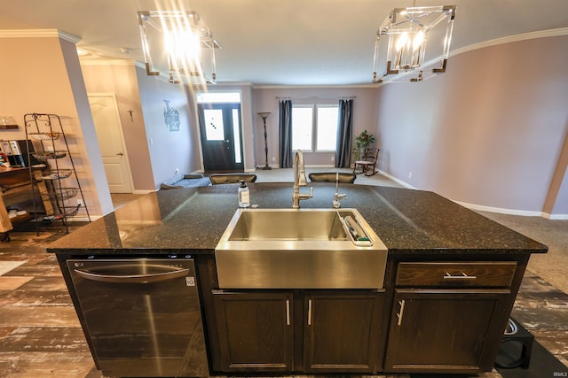 kitchen featuring dark brown cabinets, open floor plan, ornamental molding, and a sink