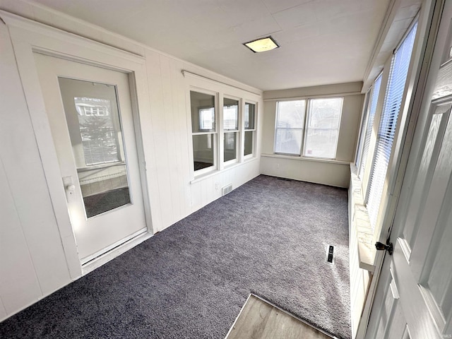 unfurnished sunroom featuring visible vents