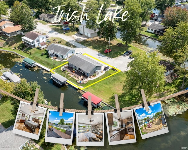 bird's eye view featuring a residential view and a water view