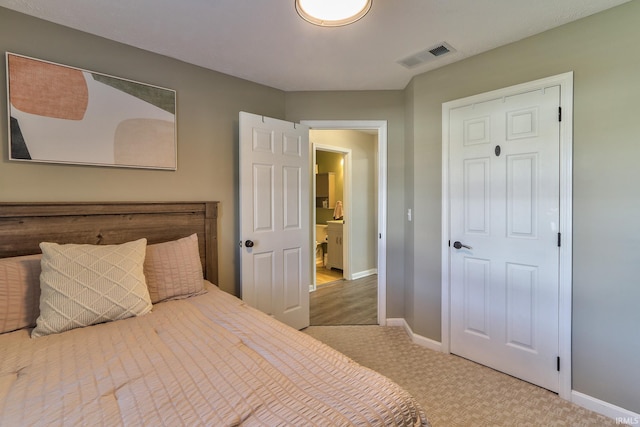 bedroom with carpet flooring, baseboards, and visible vents