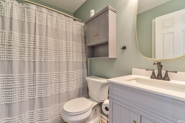 full bath with a shower with shower curtain, a textured ceiling, toilet, and vanity