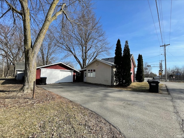 view of side of property featuring driveway