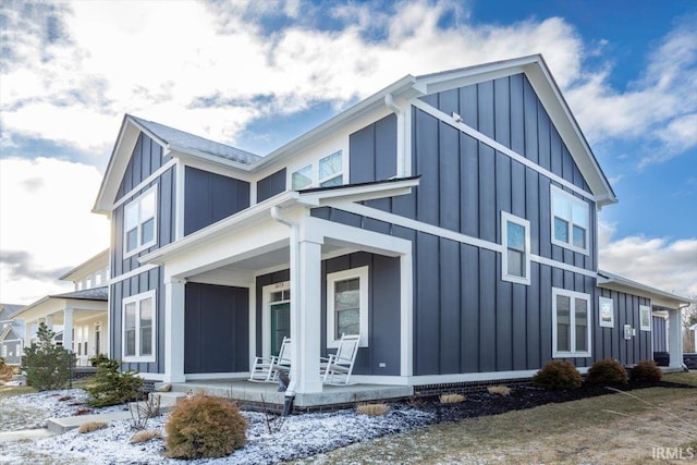 view of home's exterior with a porch and board and batten siding