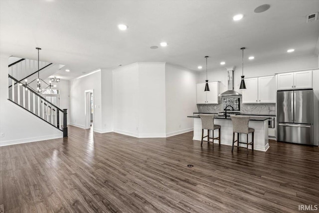 living area featuring crown molding, stairway, dark wood-style floors, and baseboards