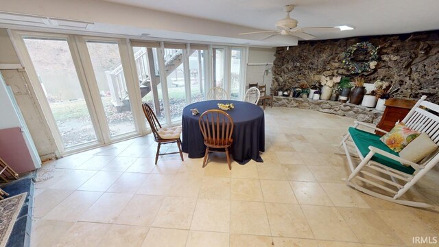 dining space featuring ceiling fan