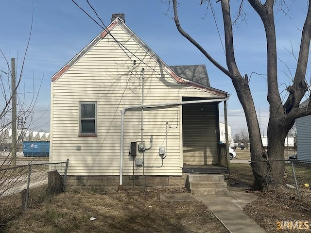 view of side of property with fence