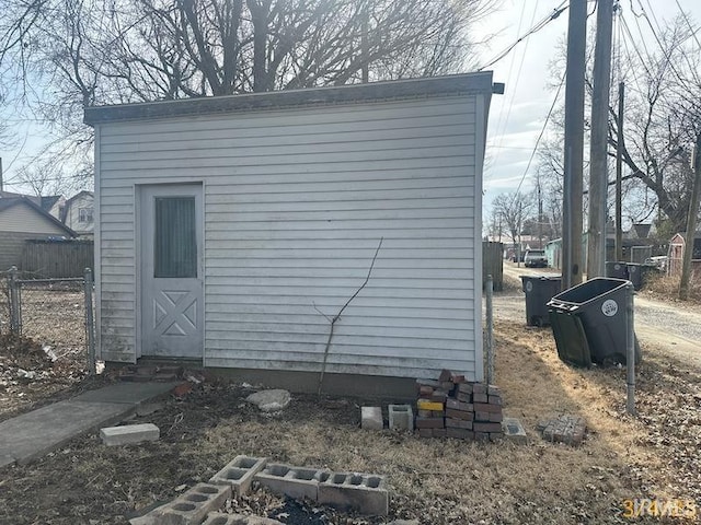 view of outbuilding featuring an outbuilding and fence