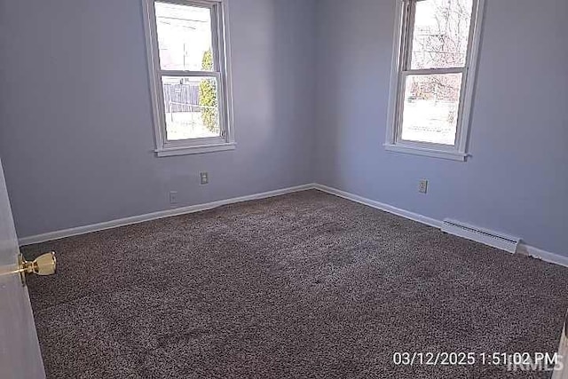 empty room featuring baseboards and visible vents