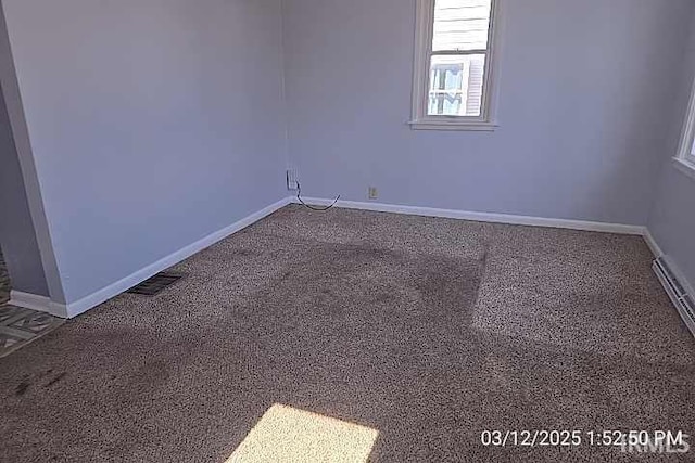 unfurnished room with baseboards