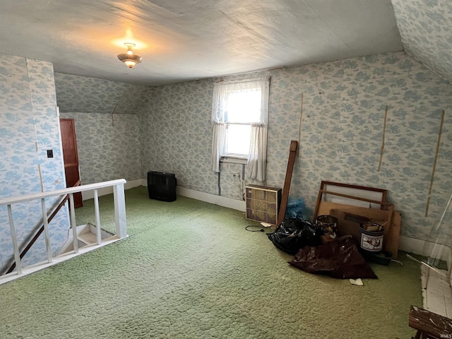 additional living space with carpet flooring and wallpapered walls