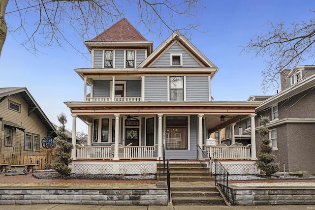 view of front of home with a porch and a ceiling fan