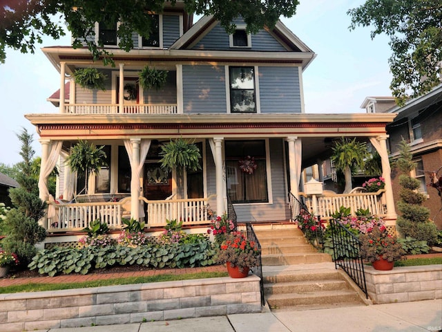 view of front of property with a porch and a balcony