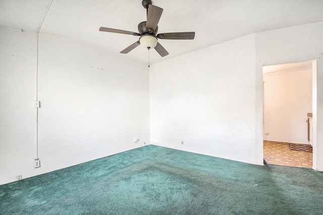 empty room featuring ceiling fan and carpet flooring