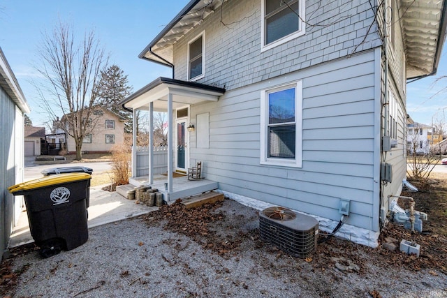 view of side of home featuring central AC unit