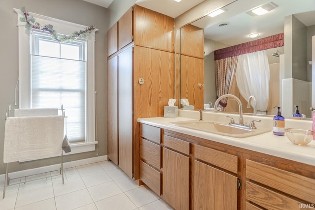 bathroom with tile patterned floors, visible vents, curtained shower, baseboards, and vanity