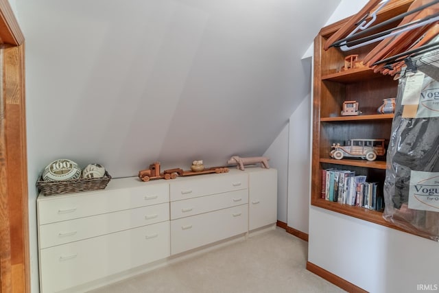 walk in closet featuring vaulted ceiling