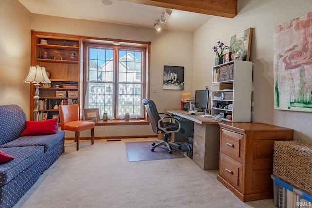 office area with beamed ceiling, baseboards, visible vents, and light carpet