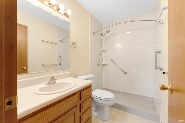 bathroom featuring a shower, toilet, and vanity