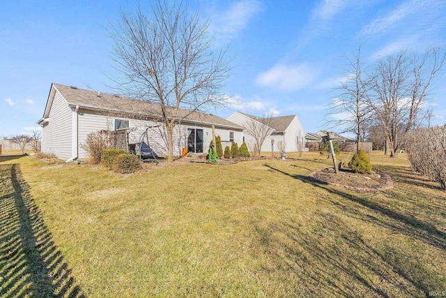 back of house featuring a yard