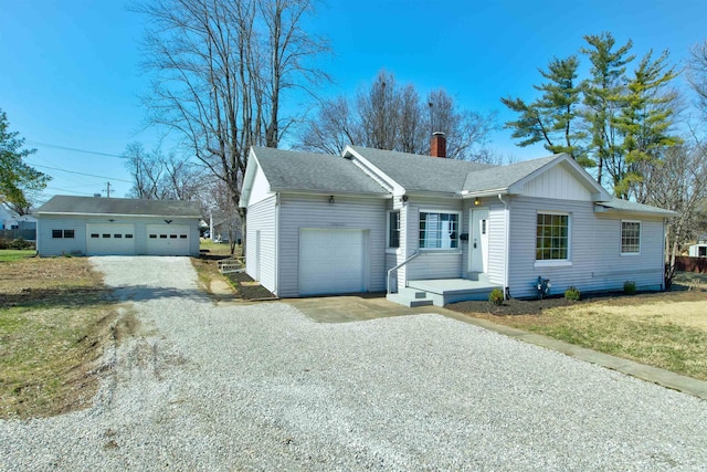 ranch-style house featuring roof with shingles, a front yard, a chimney, driveway, and an attached garage