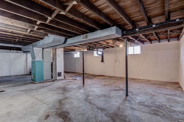 basement with heating unit and visible vents