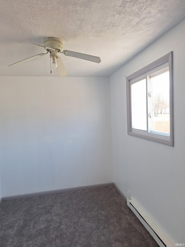 carpeted spare room with a textured ceiling, baseboard heating, and ceiling fan