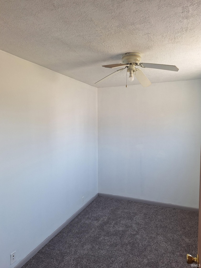 spare room with baseboards, a ceiling fan, carpet flooring, and a textured ceiling