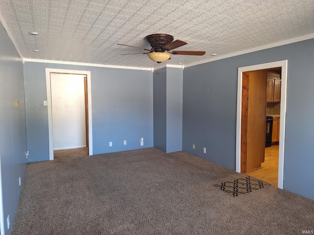 unfurnished bedroom with crown molding, carpet flooring, and a ceiling fan