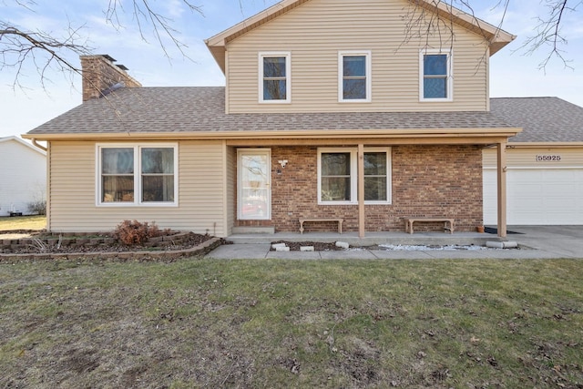 view of front facade with driveway, roof with shingles, a chimney, a front lawn, and brick siding