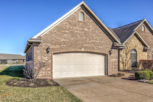 view of front of home with a garage, brick siding, and driveway