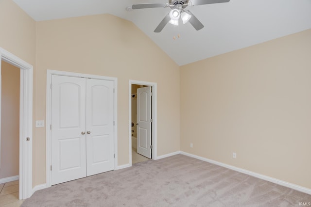 unfurnished bedroom featuring light carpet, baseboards, a ceiling fan, and a closet