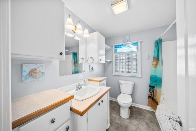 bathroom with baseboards, toilet, vanity, and a shower with curtain