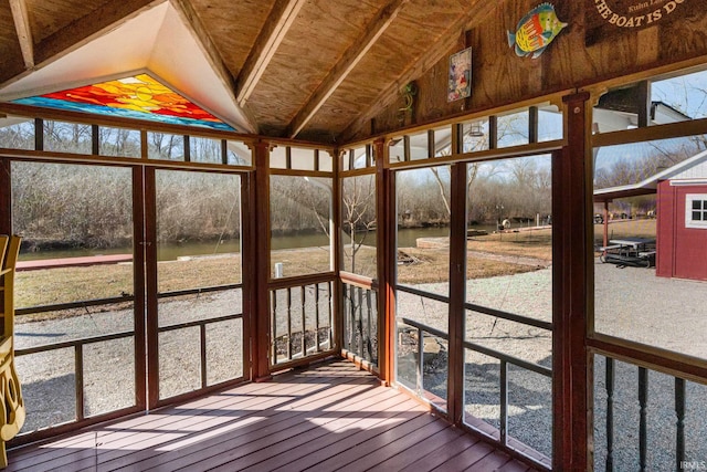 unfurnished sunroom with vaulted ceiling