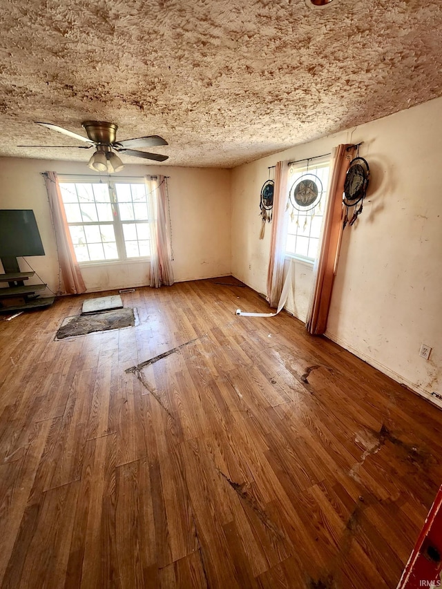 unfurnished room featuring ceiling fan and wood-type flooring