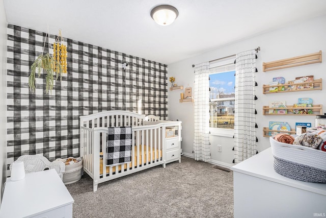 bedroom with carpet, visible vents, and baseboards