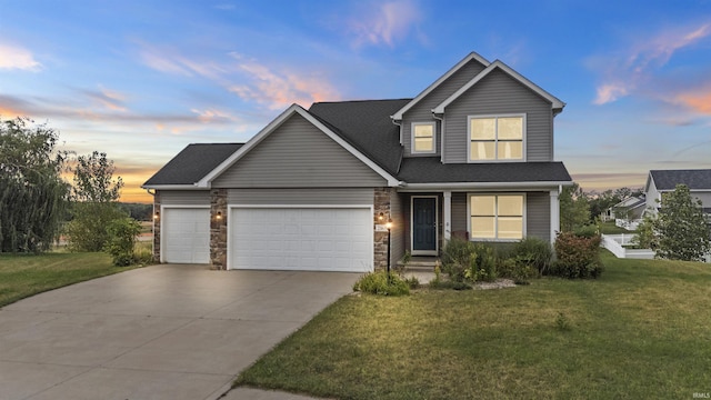 view of front facade featuring a front lawn, stone siding, concrete driveway, an attached garage, and a shingled roof