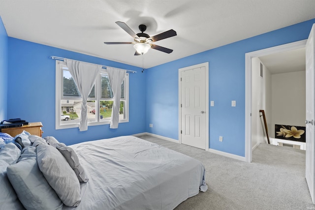 bedroom featuring carpet flooring, ceiling fan, and baseboards