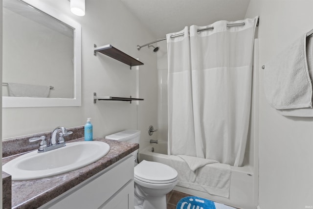 full bathroom featuring toilet, vanity, and shower / tub combo